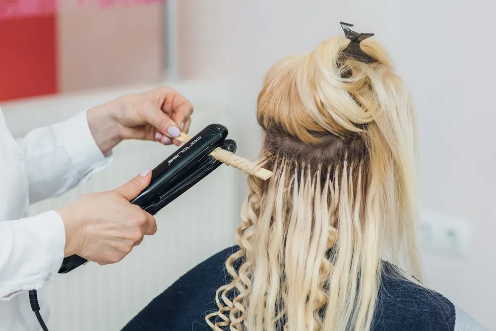 Photo of hair extensions being installed